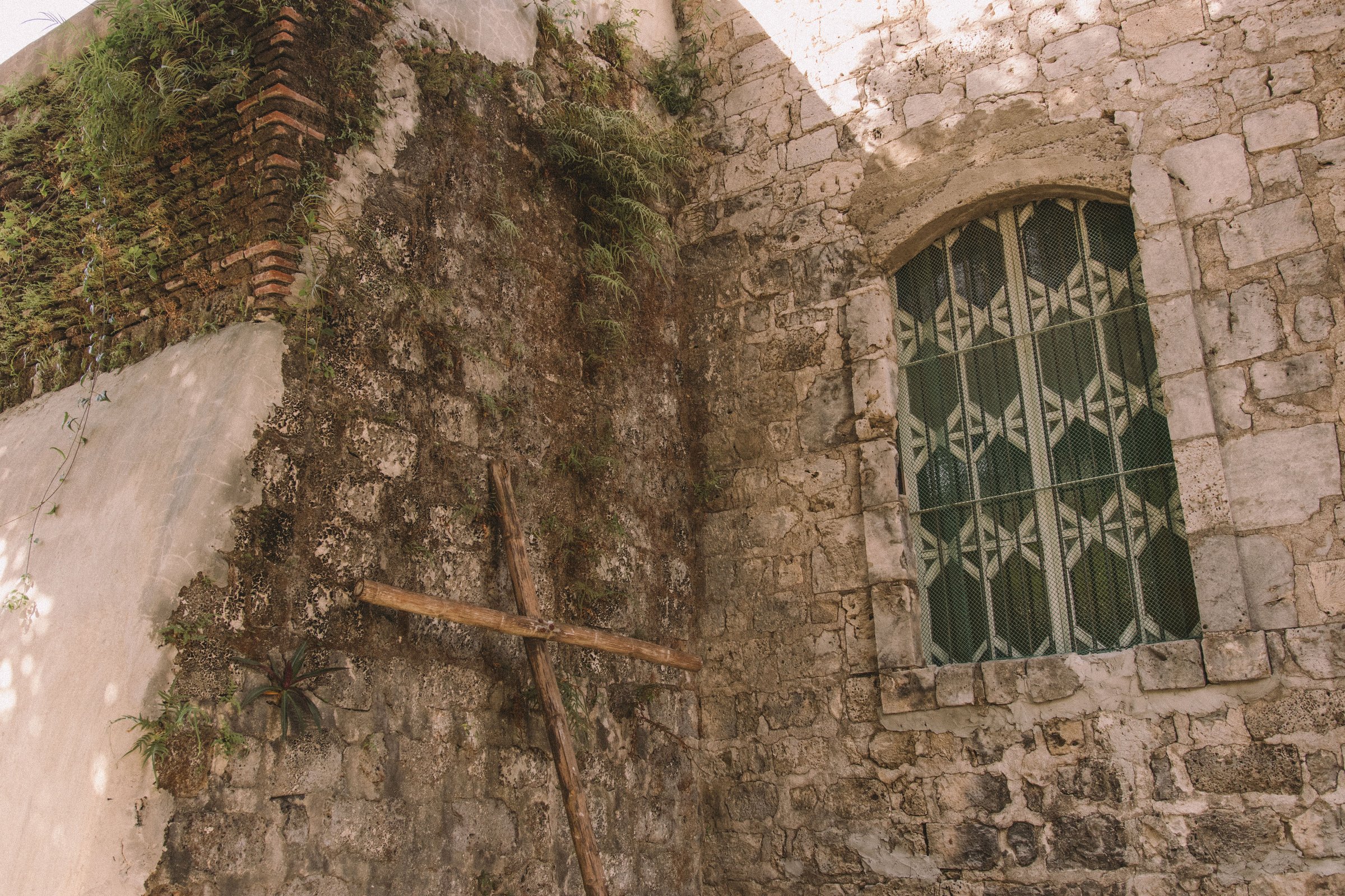 Wooden Cross Outside an Old Church